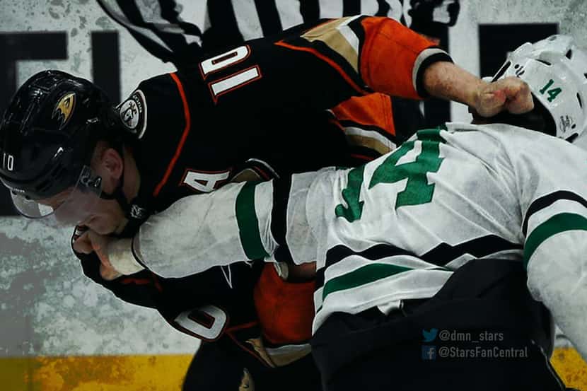 Anaheim's Corey Perry [left] throwing down with Dallas' Jamie Benn [right].