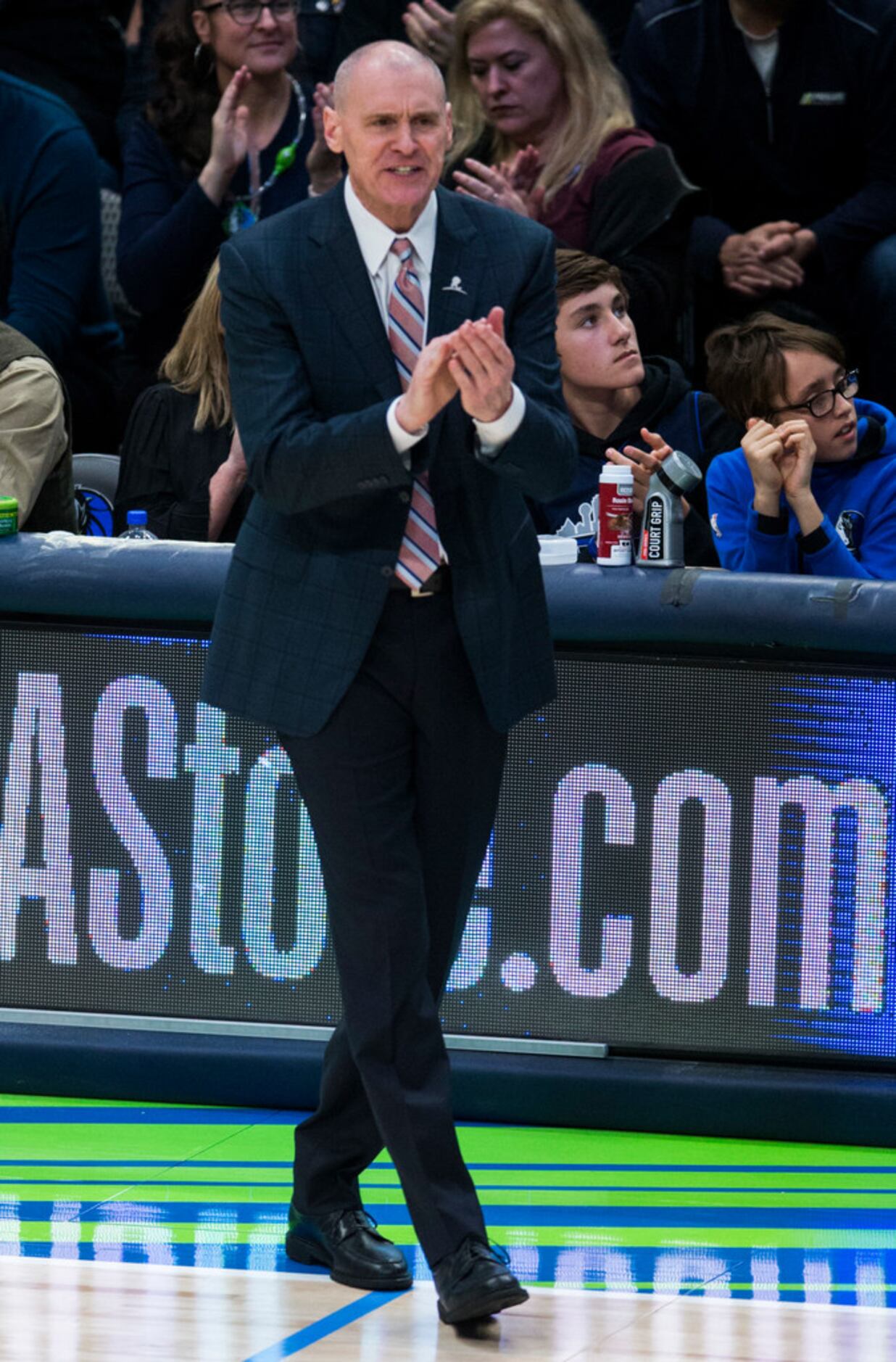Dallas Mavericks head coach Rick Carlisle applauds during the fourth quarter of an NBA game...