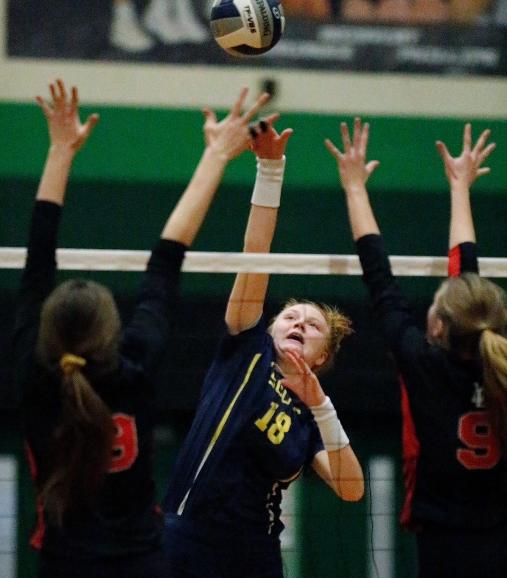 Highland Park High School outside hitter Kendyl Reaugh (18) tips the ball over Lovejoy High...