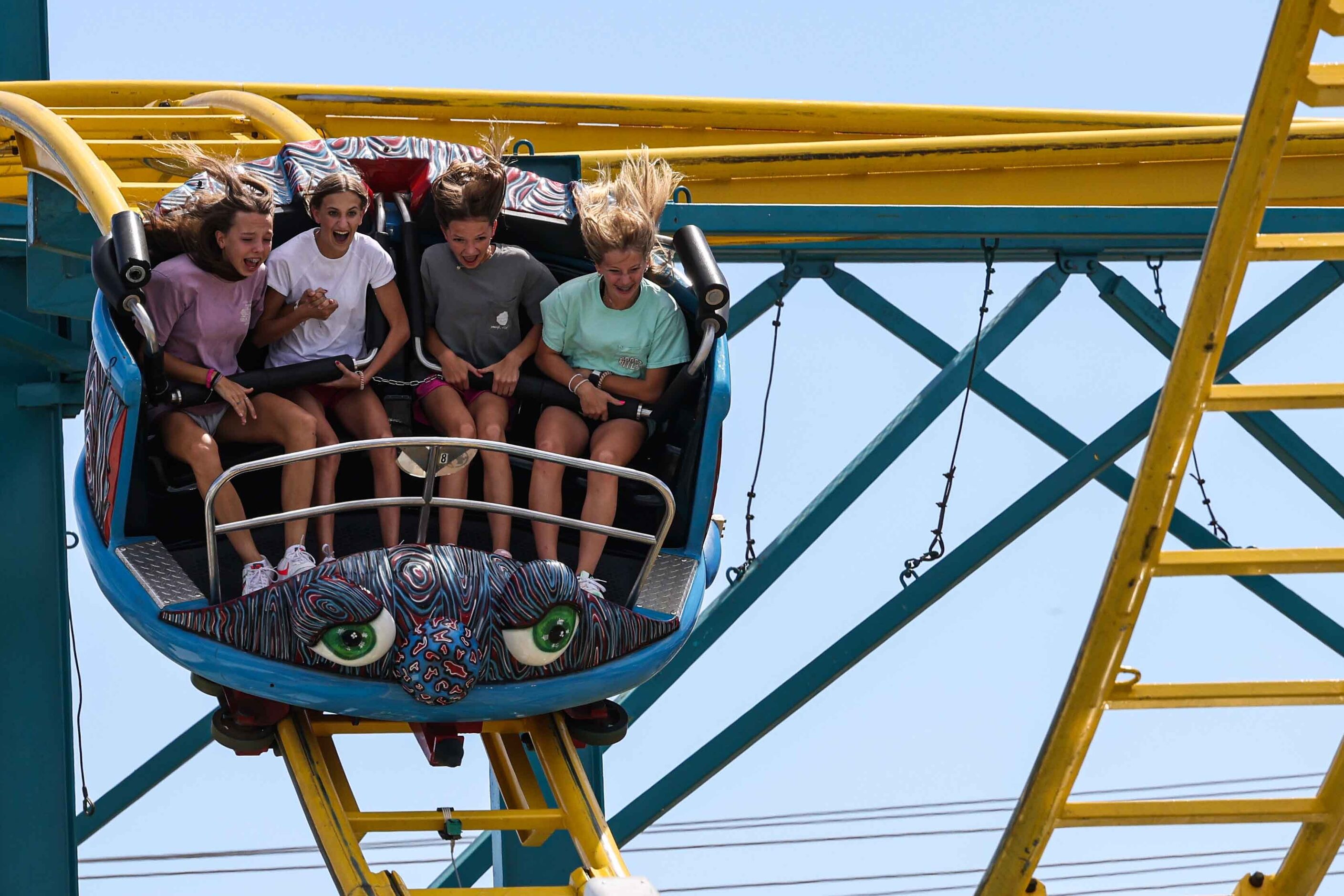 People aboard a carnival ride at the State Fair of Texas during its opening day in Dallas on...