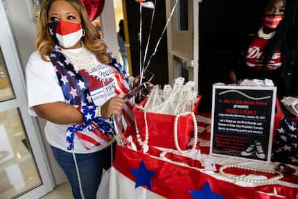 Campus Coordinator Vonda Pipkin pushes a cart of pearls at Billy Earl Dade Middle School in...