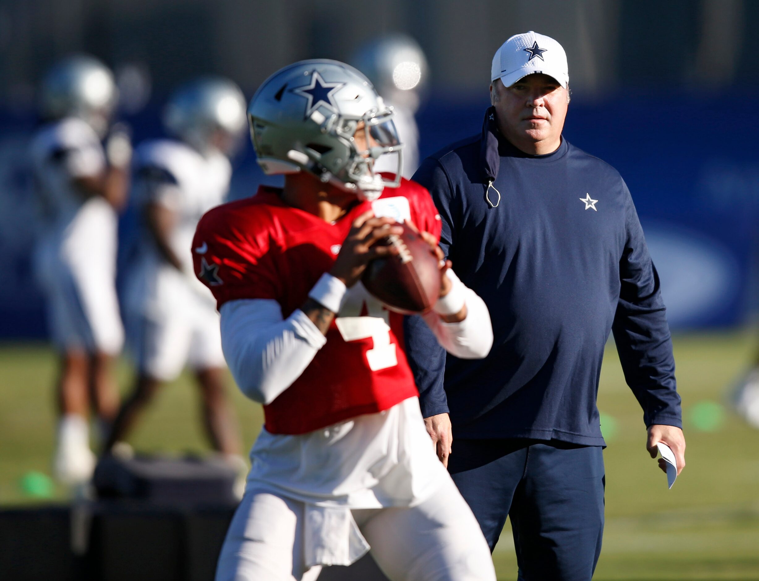 Dallas Cowboys head coach Mike McCarthy watches as Dallas Cowboys quarterback Dak Prescott...