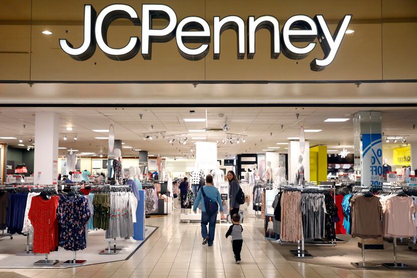 Shoppers enter the former Collin Creek Mall J.C. Penney store in Plano. It permanently...