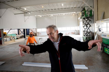 Alex Wilcox, CEO and co-founder of JSX, speaks to the press as construction continues at...