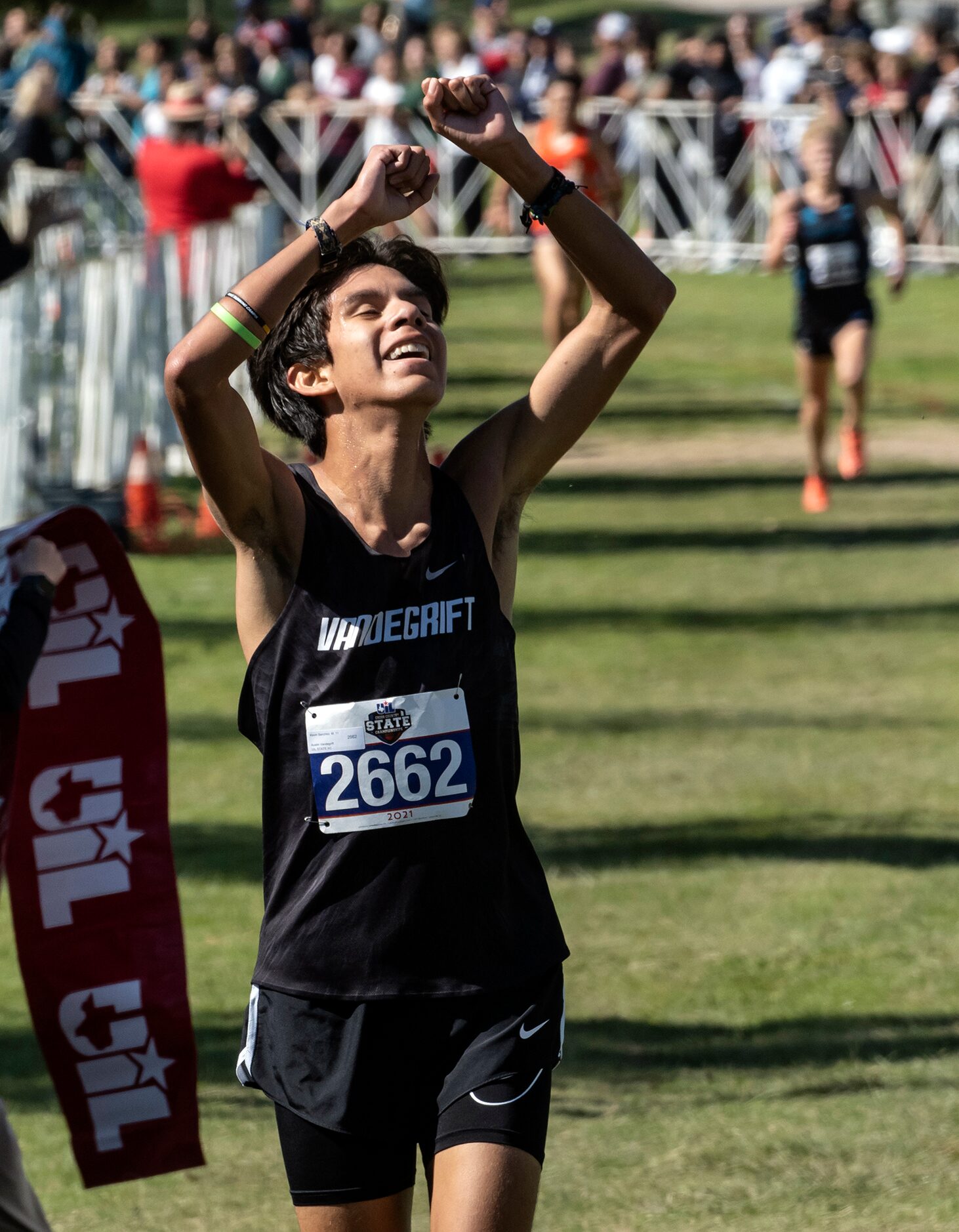 Austin Vandegrift Kevin Sanchez, (2662), celebrates after crossing the finish line winning...