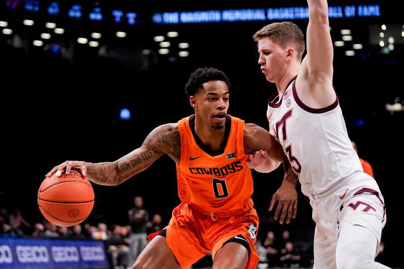 Oklahoma State guard Avery Anderson III (0) drives past Virginia Tech guard Sean Pedulla (3)...