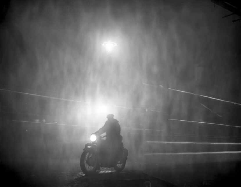 A motorcyclist crosses Ludgate Circus in London on Dec. 6, 1952, during the deadly smog. 