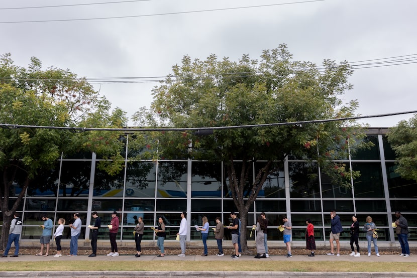 People wrap around the Oak Lawn public library on the last day of early voting in Dallas on...