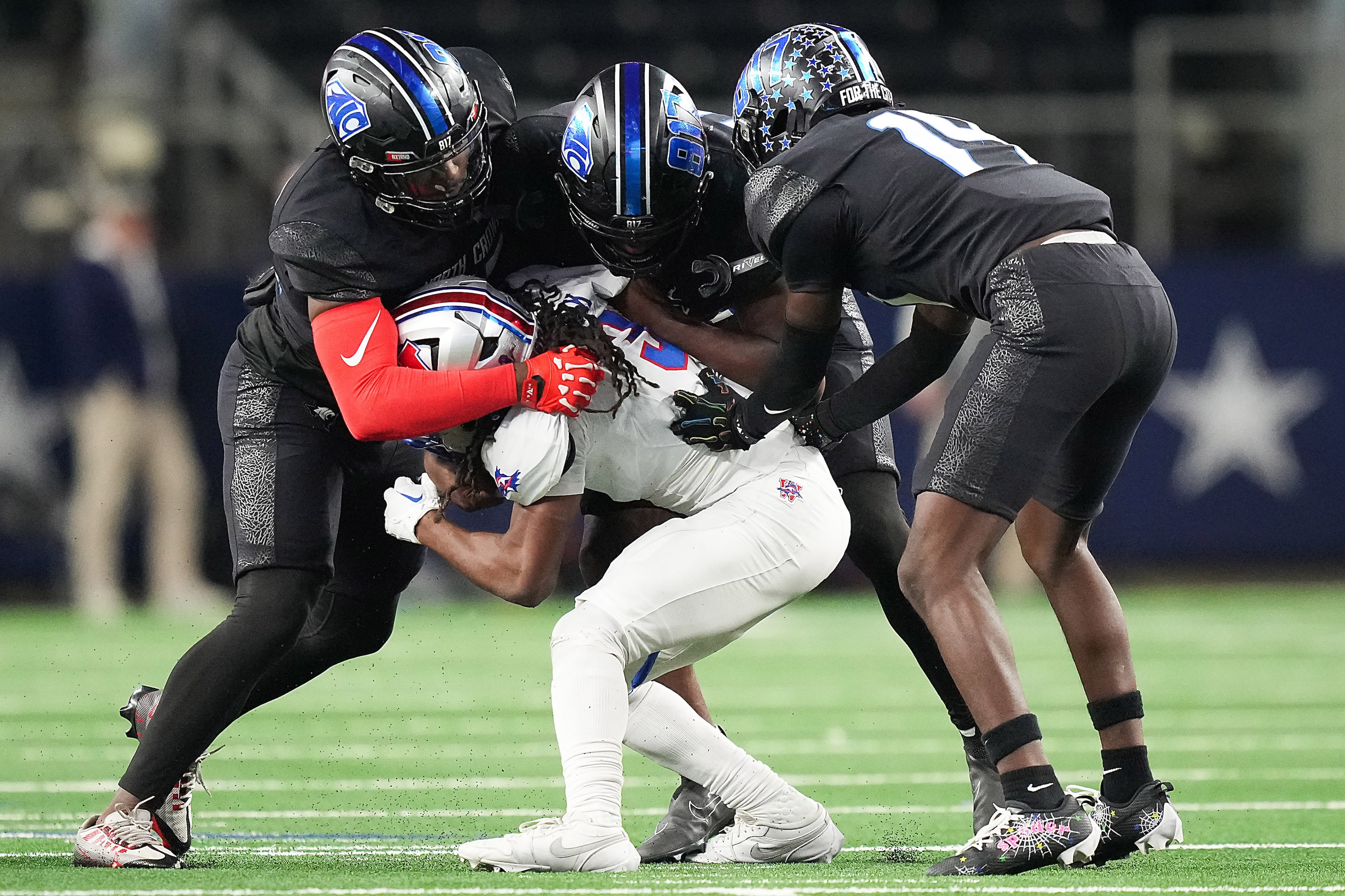 Austin Westlake running back Elijah Clark (3) is swarmed by the North Crowley defense during...