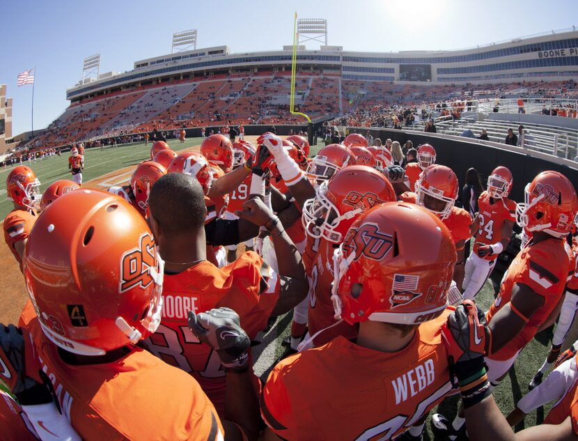 Nov 17, 2012; Stillwater OK, USA; Oklahoma State Cowboys team huddle before the game against...