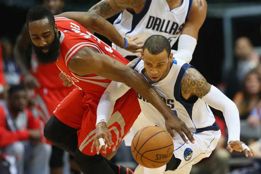 DALLAS, TX - FEBRUARY 20: (L-R) James Harden #13 of the Houston Rockets challenges Monta...