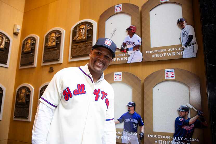 Rangers legend Adrián Beltré poses for a photo in his Hall of Fame jersey and hat.