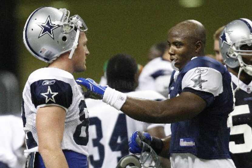 ORG XMIT: *S0427208707* The Dallas Cowboys DeMarcus Ware, right, talks with teammate Jason...