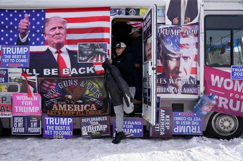 An RV  parked outside Team Trump New Hampshire headquarters, is visited by supporters on...