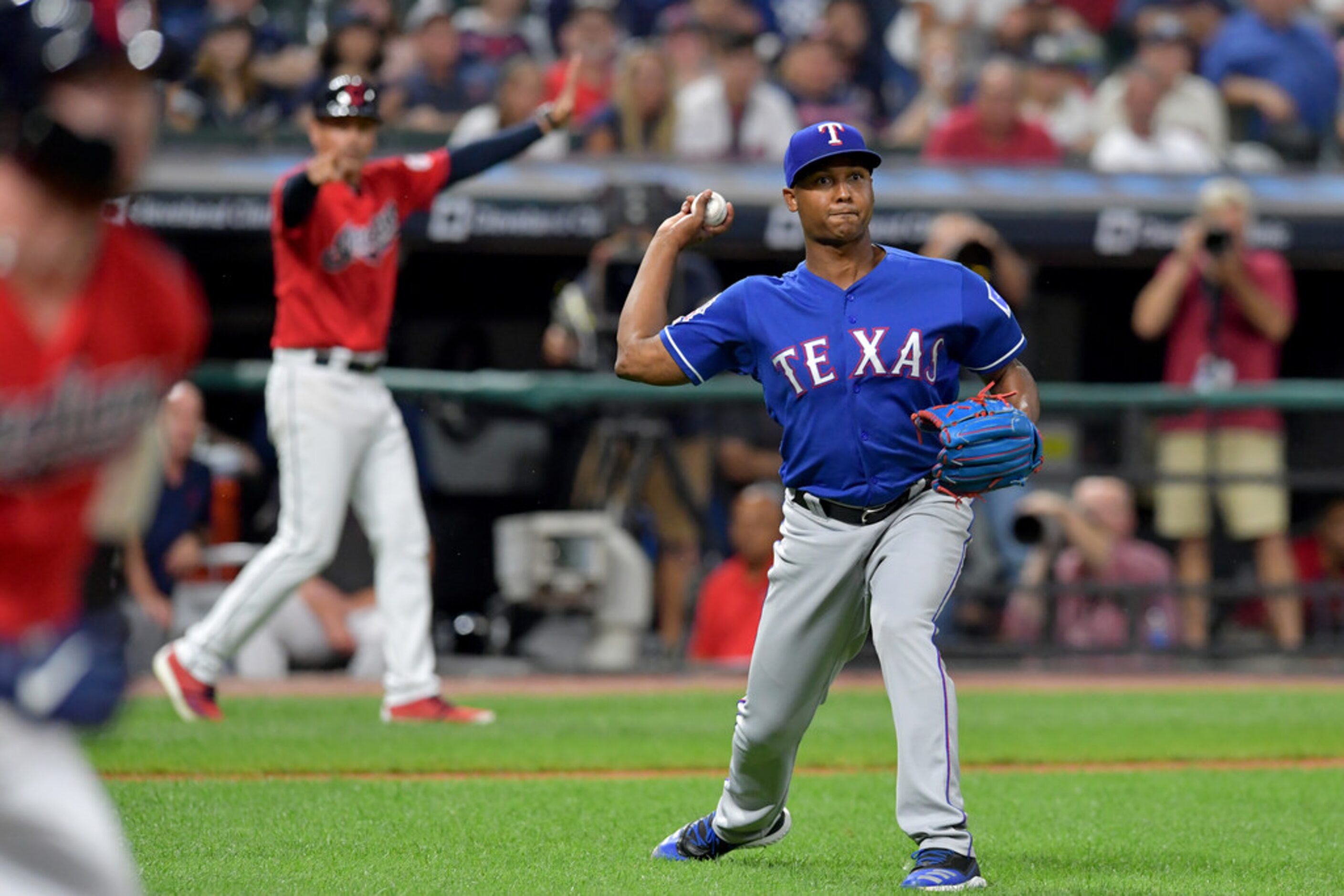 CLEVELAND, OHIO - AUGUST 05: Closing pitcher Jose Leclerc #25 of the Texas Rangers throws...