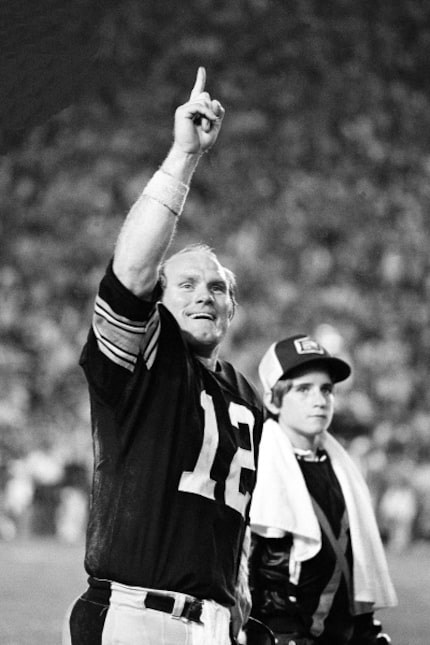 Pittsburgh Steelers quarterback Terry Bradshaw holds up one finger, indicating his team is...