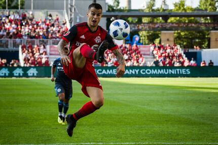 Toronto FC forward Sebastian Giovinco (10) jumps to receive a pass in the second half of MLS...