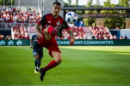 Toronto FC forward Sebastian Giovinco (10) jumps to receive a pass in the second half of MLS...