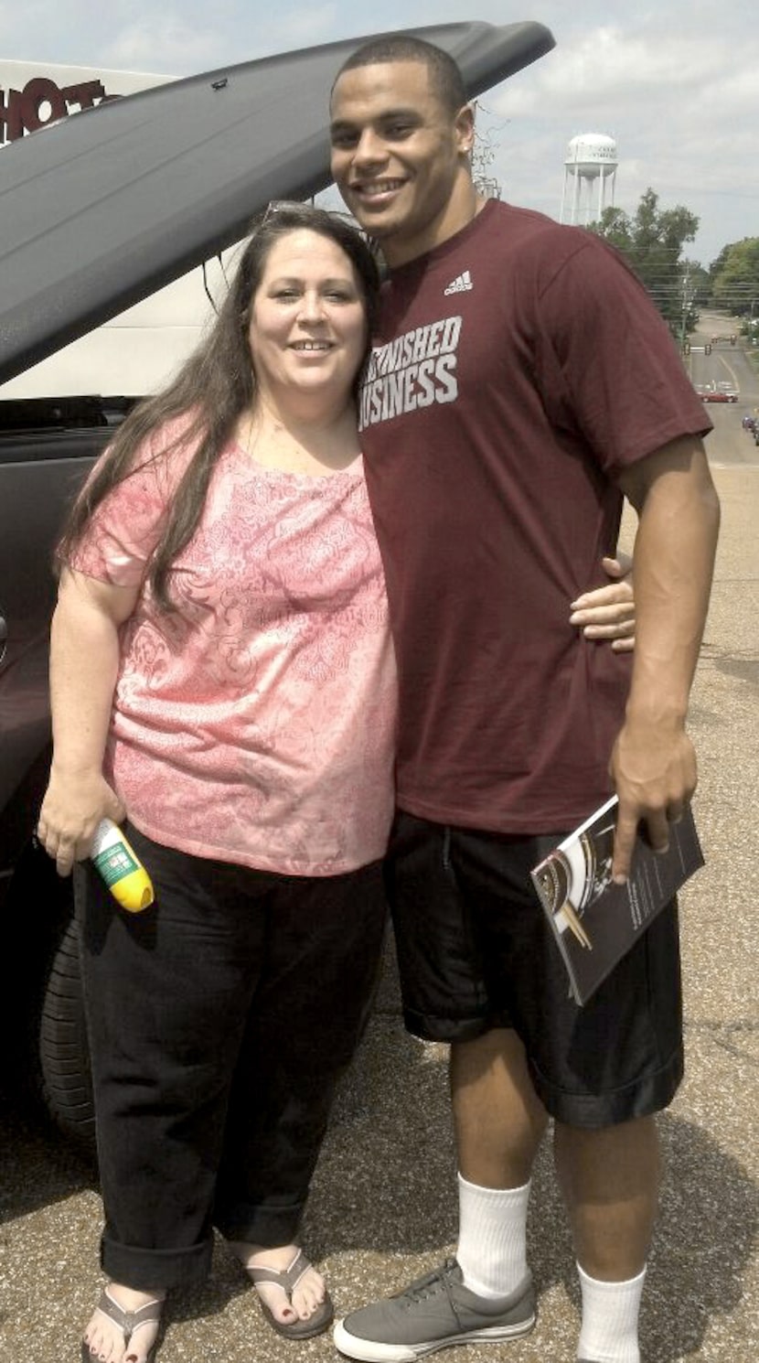 MSU QB Dak Prescott with his mom, Peggy Prescott, in December of 2012.