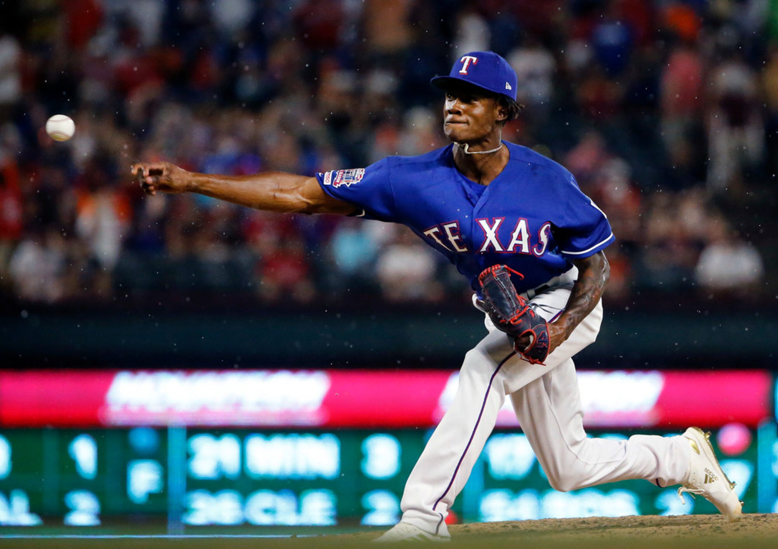 Texas Rangers relief pitcher Phillips Valdez (67) throws in the rain against the Houston...