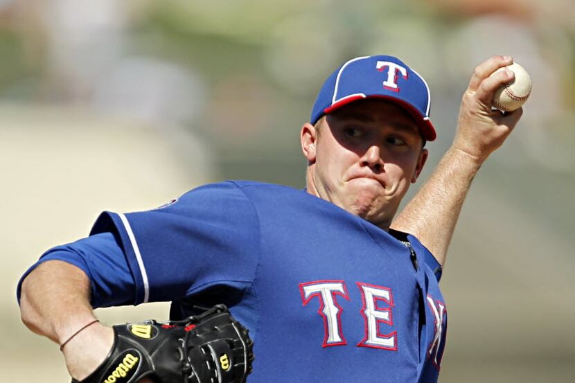 Texas Rangers starting pitcher Robbie Ross pitches during the seventh inning of Texas' 6-1...