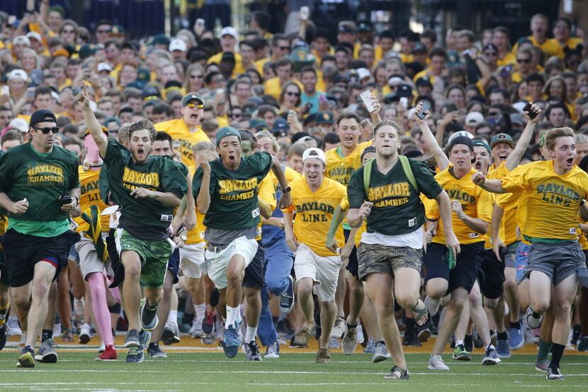 Baylor students storm the field in their pre-game tradition before the Northwestern State...
