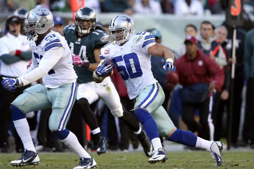 Dallas Cowboys middle linebacker Sean Lee (50) runs with the ball after intercepting a pass...
