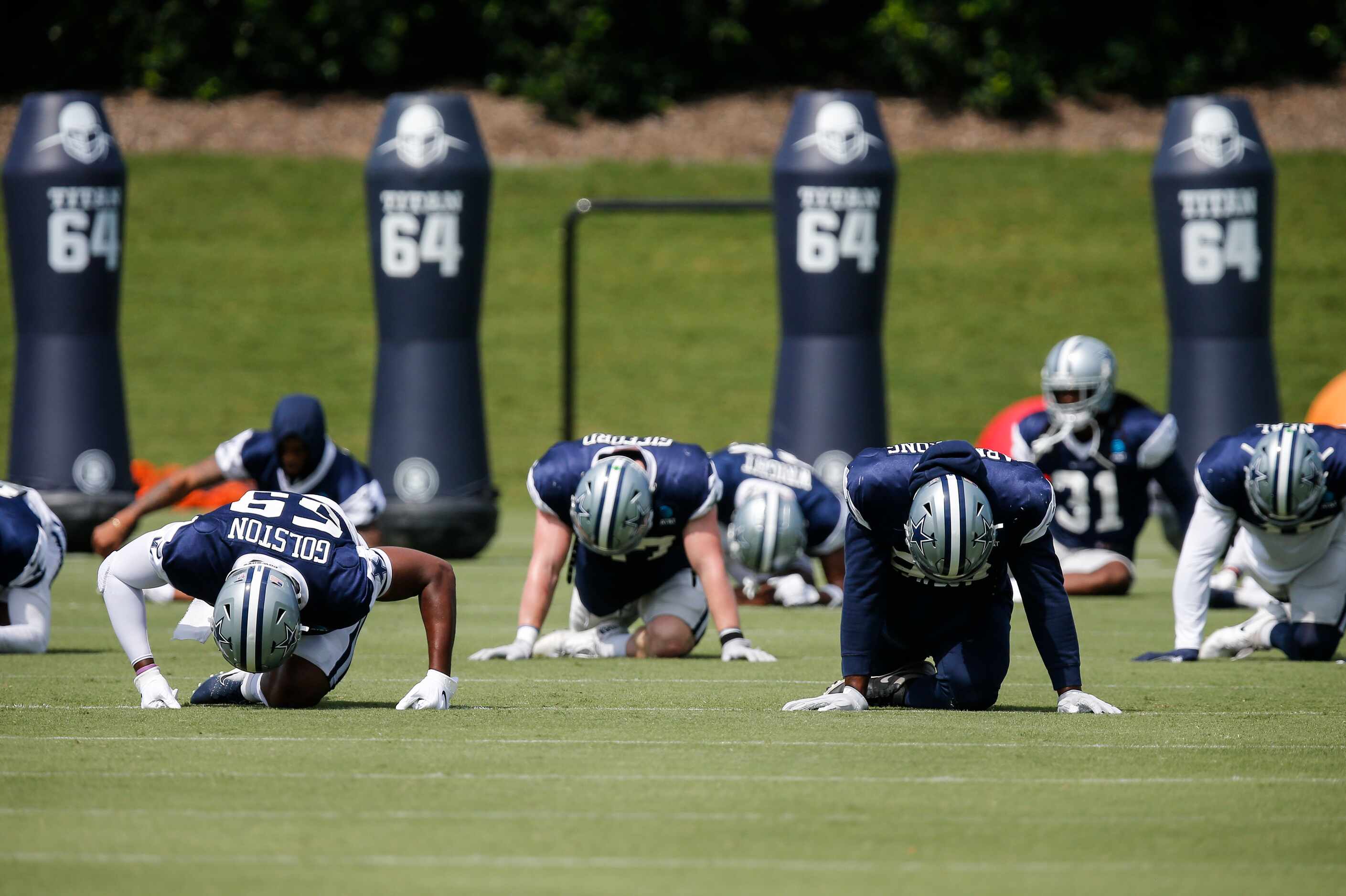 Dallas Cowboys players stretch during practice at The Star in Frisco, Friday, September 3,...