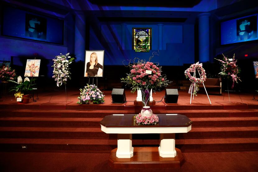 An urn containing Christina Morris' ashes, photos and flowers are seen during a memorial...
