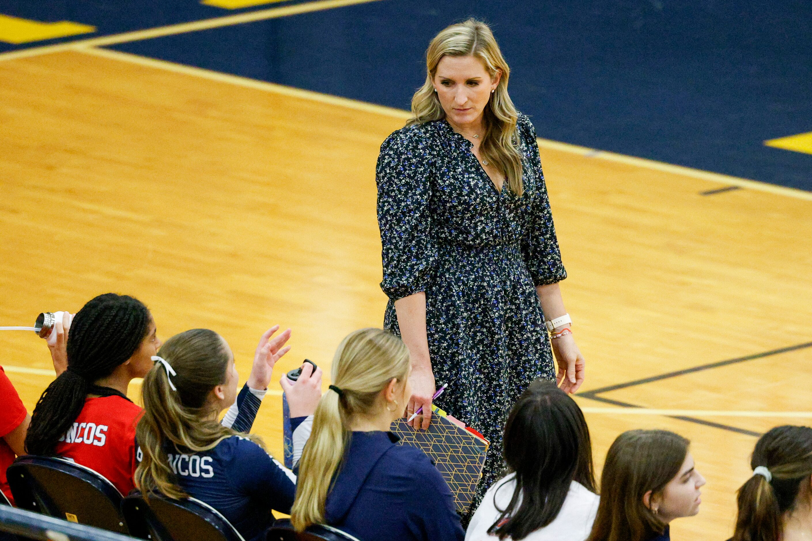 McKinney Boyd head coach JJ Castillo listens to a player during a volleyball match against...