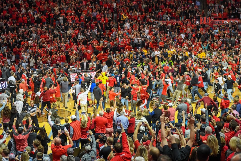 LUBBOCK, TX - JANUARY 13: The Texas Tech Red Raiders fans rush the court after the Texas...