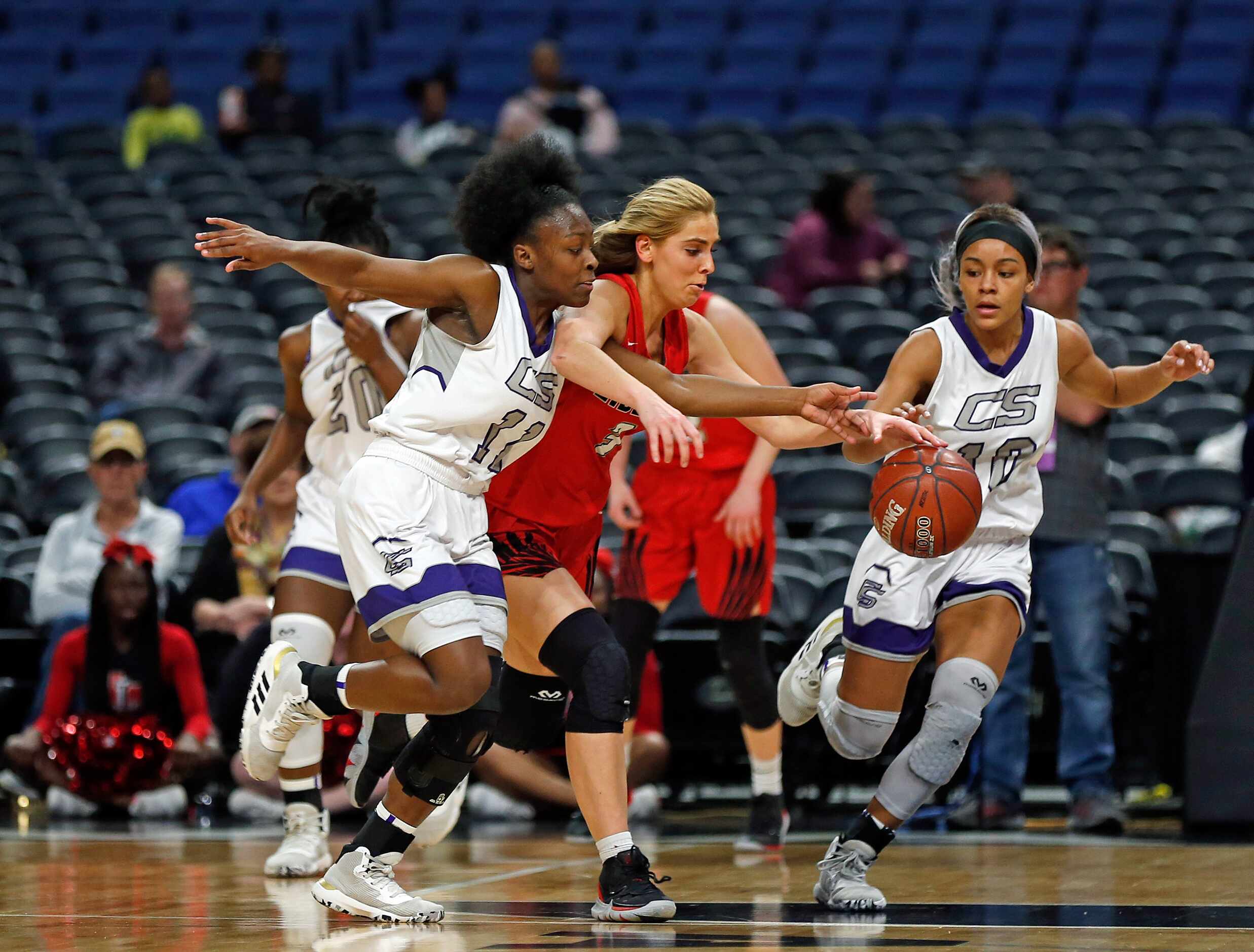 College Station guard Aliyah Collins #11 (left) tries steal the ball from Frisco Liberty...