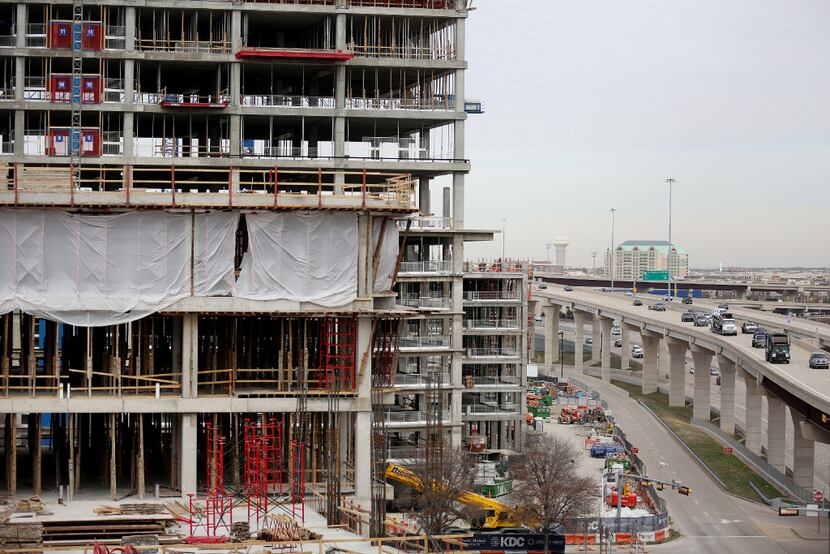 Construction continues at the Legacy West development as the Dallas North Tollway runs at...