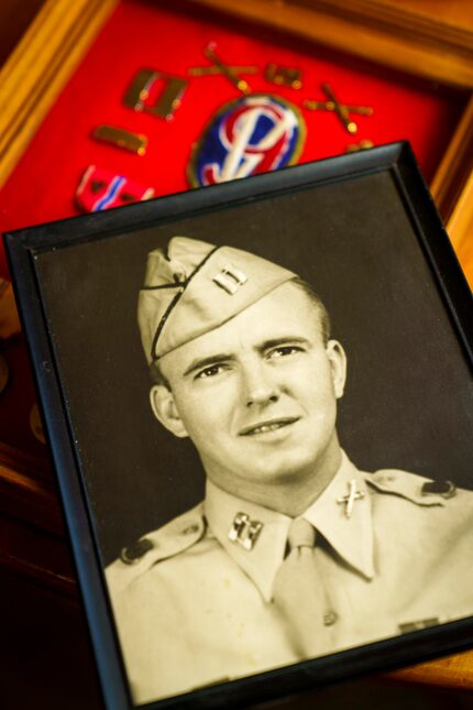 A photo of Arthur Wood at 25 lies atop his "brag box" of the medals he earned during World...