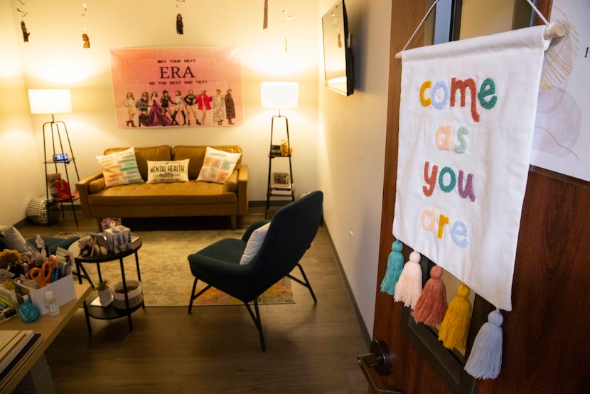 A "Come as you are" sign on therapist Holly Packer’s door greets arriving neighbors Tuesday....