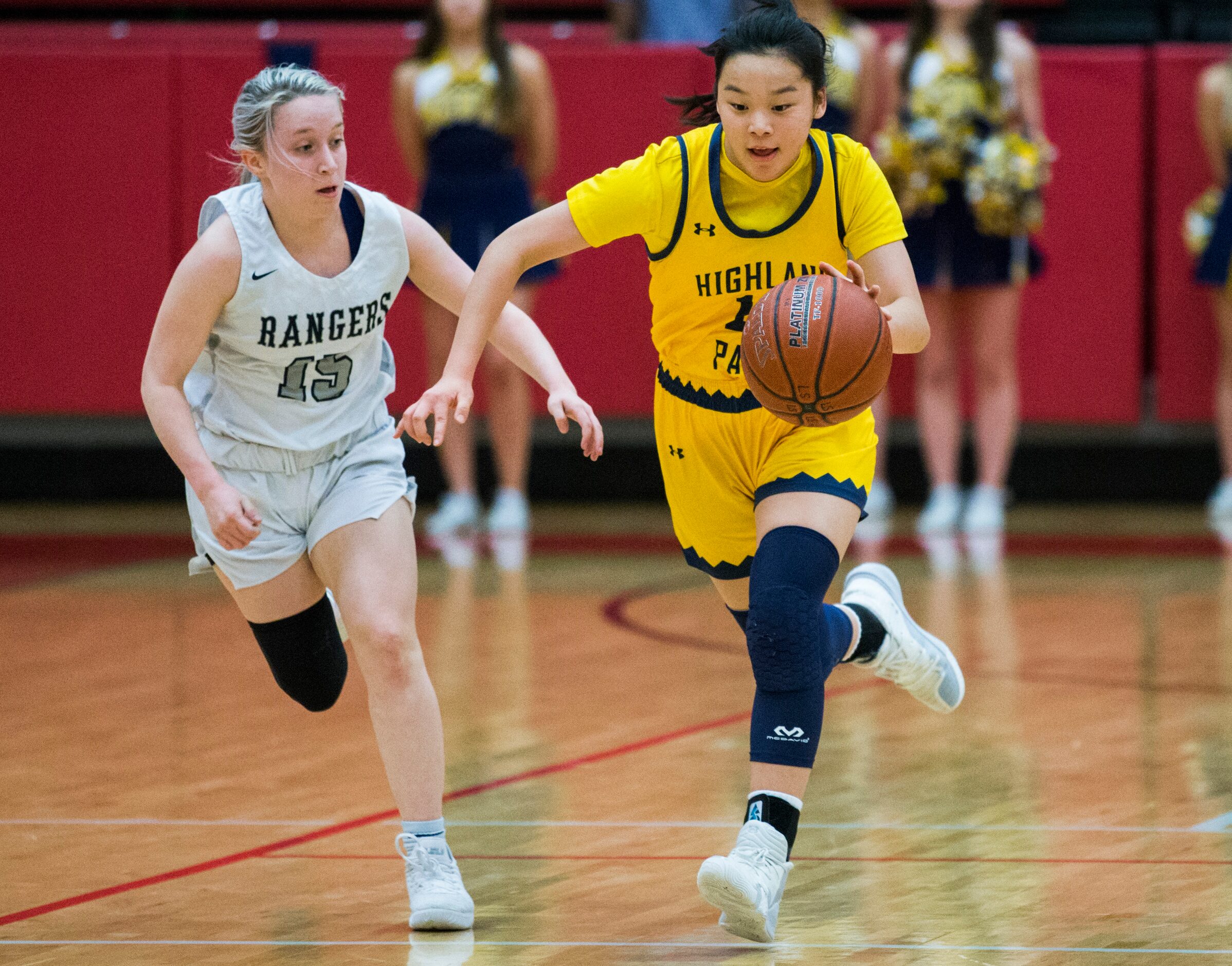 Highland Park guard Vivian Jinn (13) takes the ball down court with Frisco Lone Star guard...