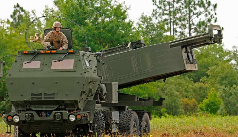 FILE - Marine Corps Sgt. Justin Russell, a High Mobility Artillery Rocket System, or HIMARS,...