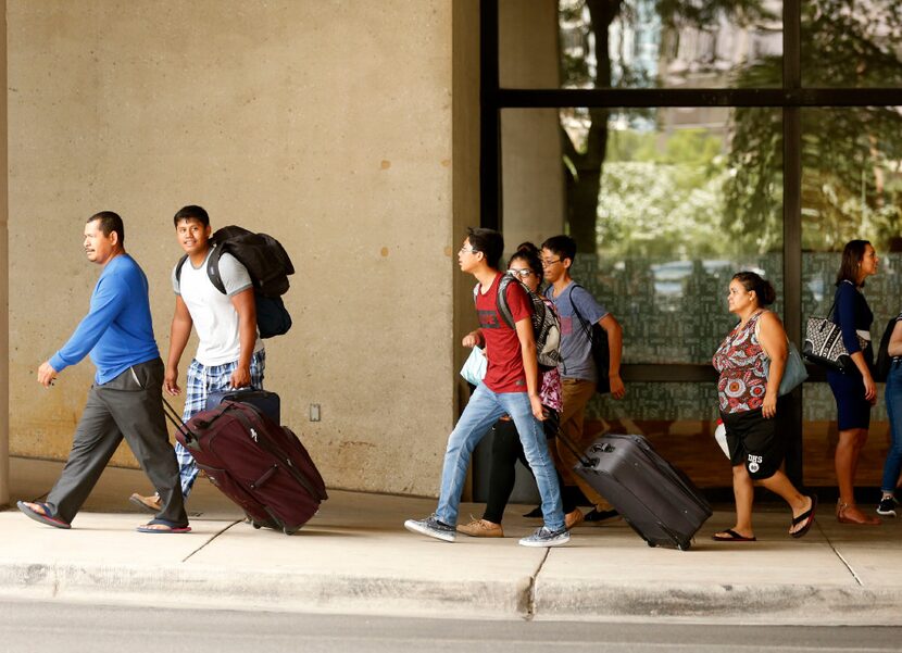 Evacuees from South Texas arrived at the "mega shelter" outside the Kay Bailey Hutchison...