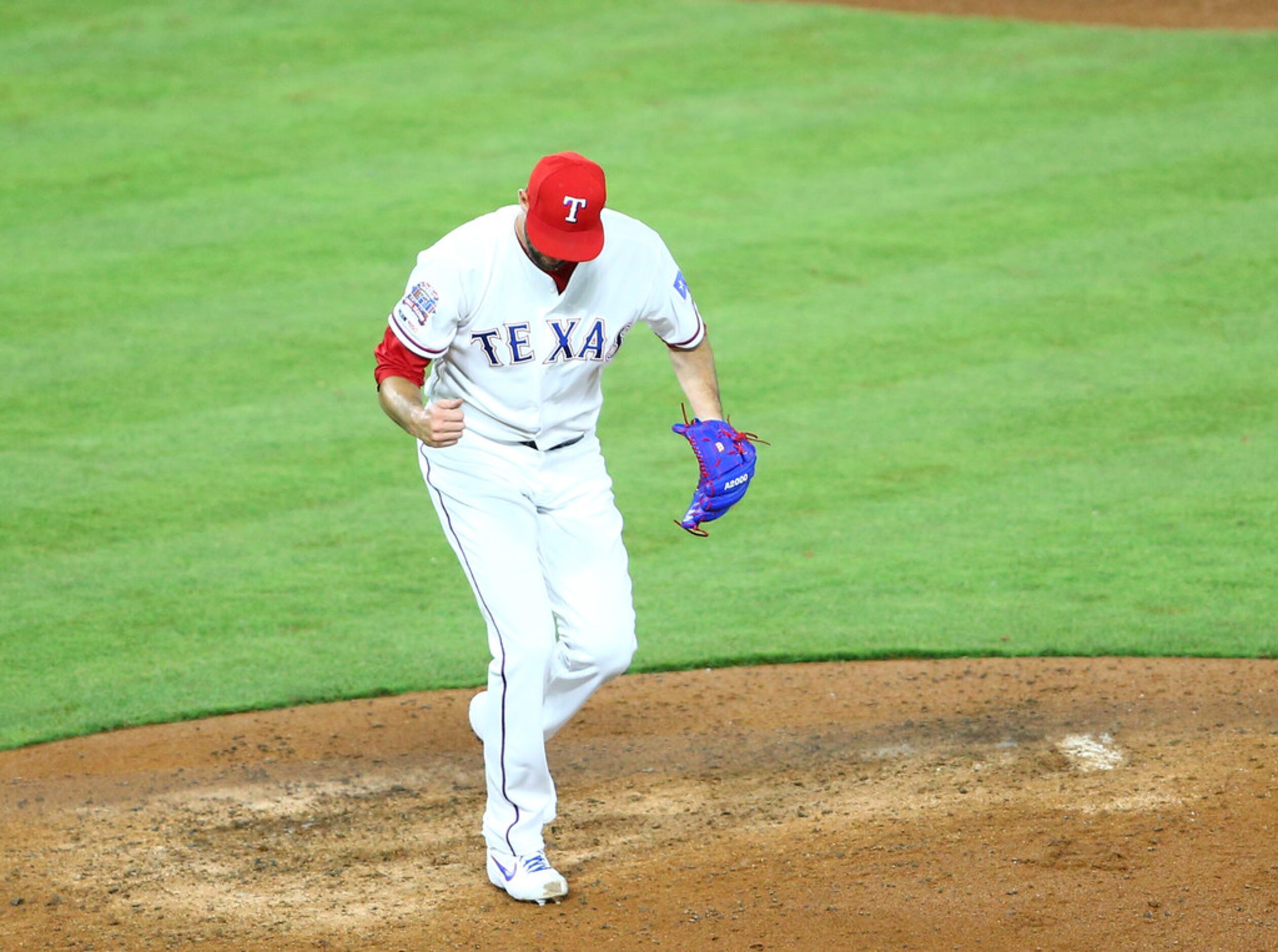 ARLINGTON, TX - JUNE 06: Chris Martin #31 of the Texas Rangers reacts after striking out the...