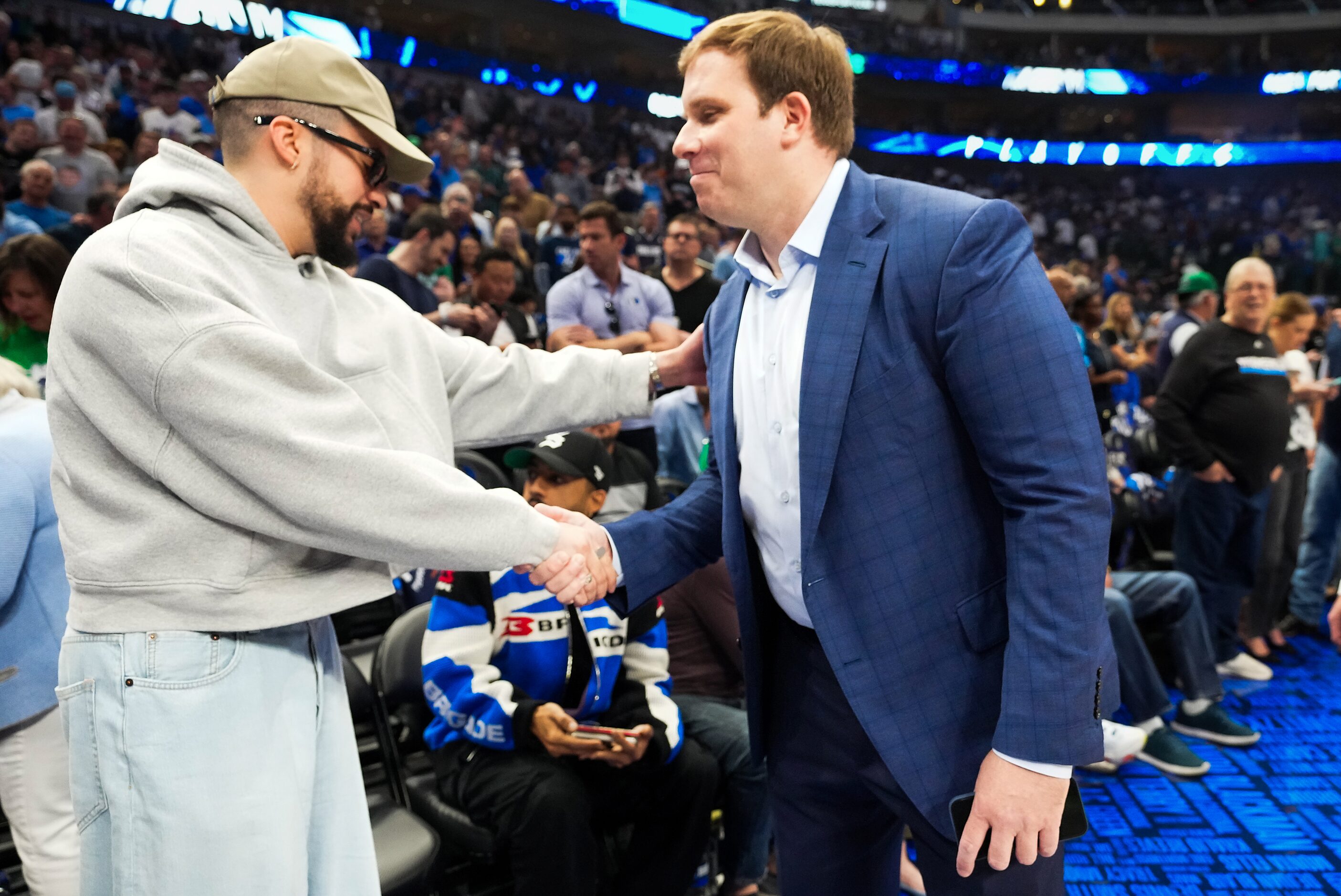 Dallas Mavericks governor and majority owner Patrick Dumont shakes hands with rapper Bad...