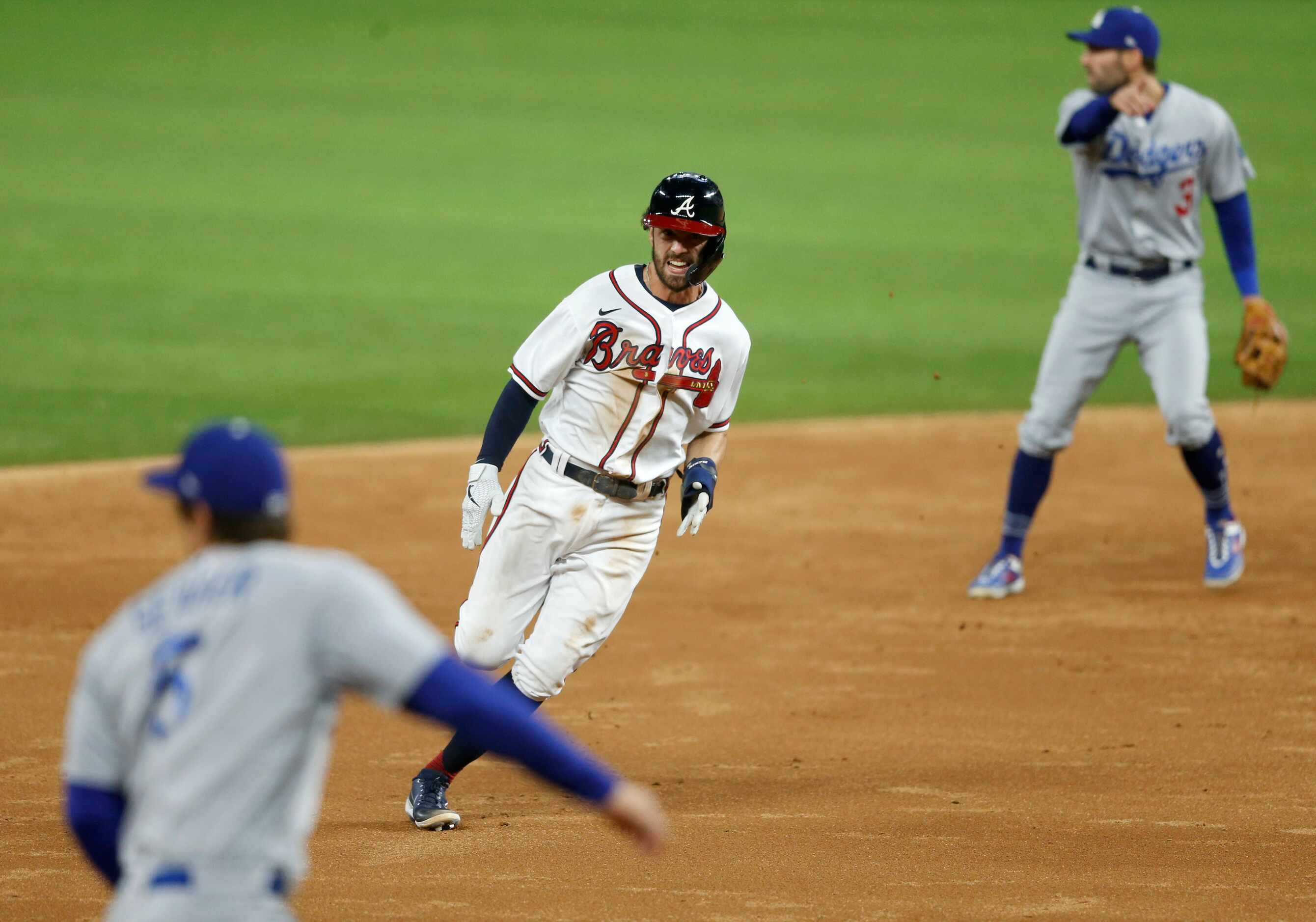 Atlanta Braves shortstop Dansby Swanson (7) runs to third base off a hit from Atlanta Braves...
