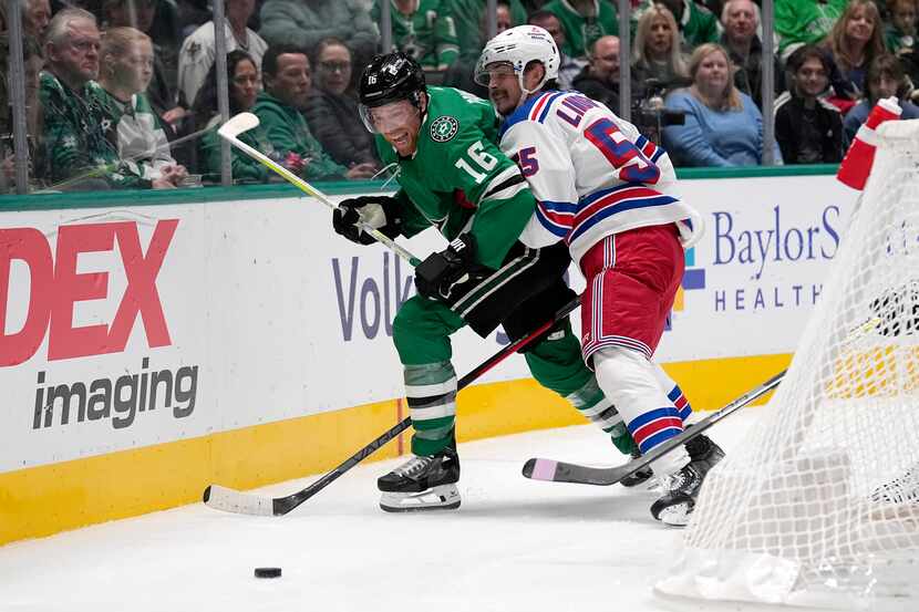 Dallas Stars center Joe Pavelski (16) attempts to reach the puck as New York Rangers...