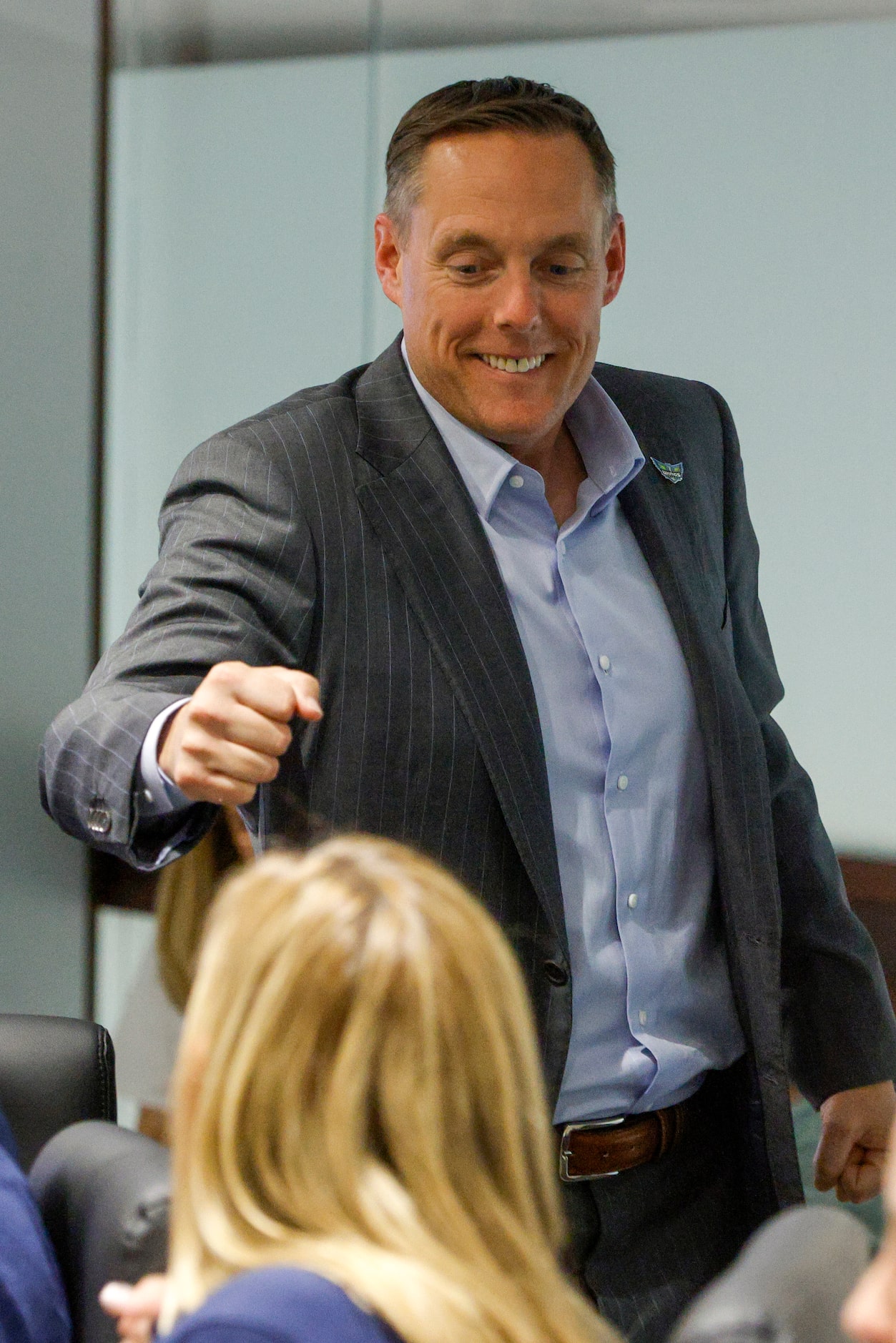 Dallas Wings President and CEO Greg Bibb fist bumps members of the coaching staff before the...