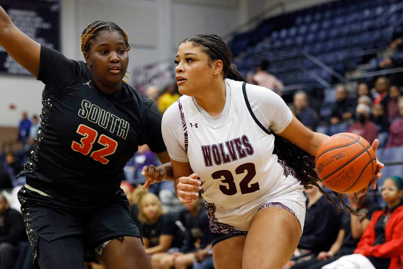 South Grand Prairie forward Cedraiah Peterson (left) defends against Mansfield Timberview...