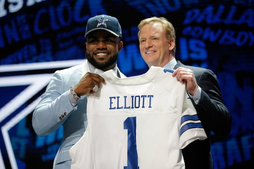 CHICAGO, IL - APRIL 28:  (L-R) Ezekiel Elliott of Ohio State holds up a jersey with NFL...