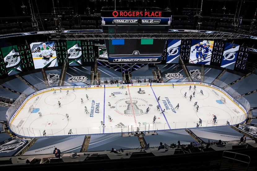 The Dallas Stars and the Tampa Bay Lightning warm up during Game One of the Stanley Cup...