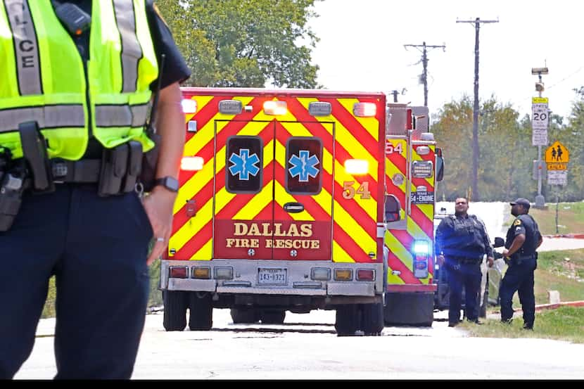 A heavy police presence is visible in front of Wilmer-Hutchins High School on Saturday.