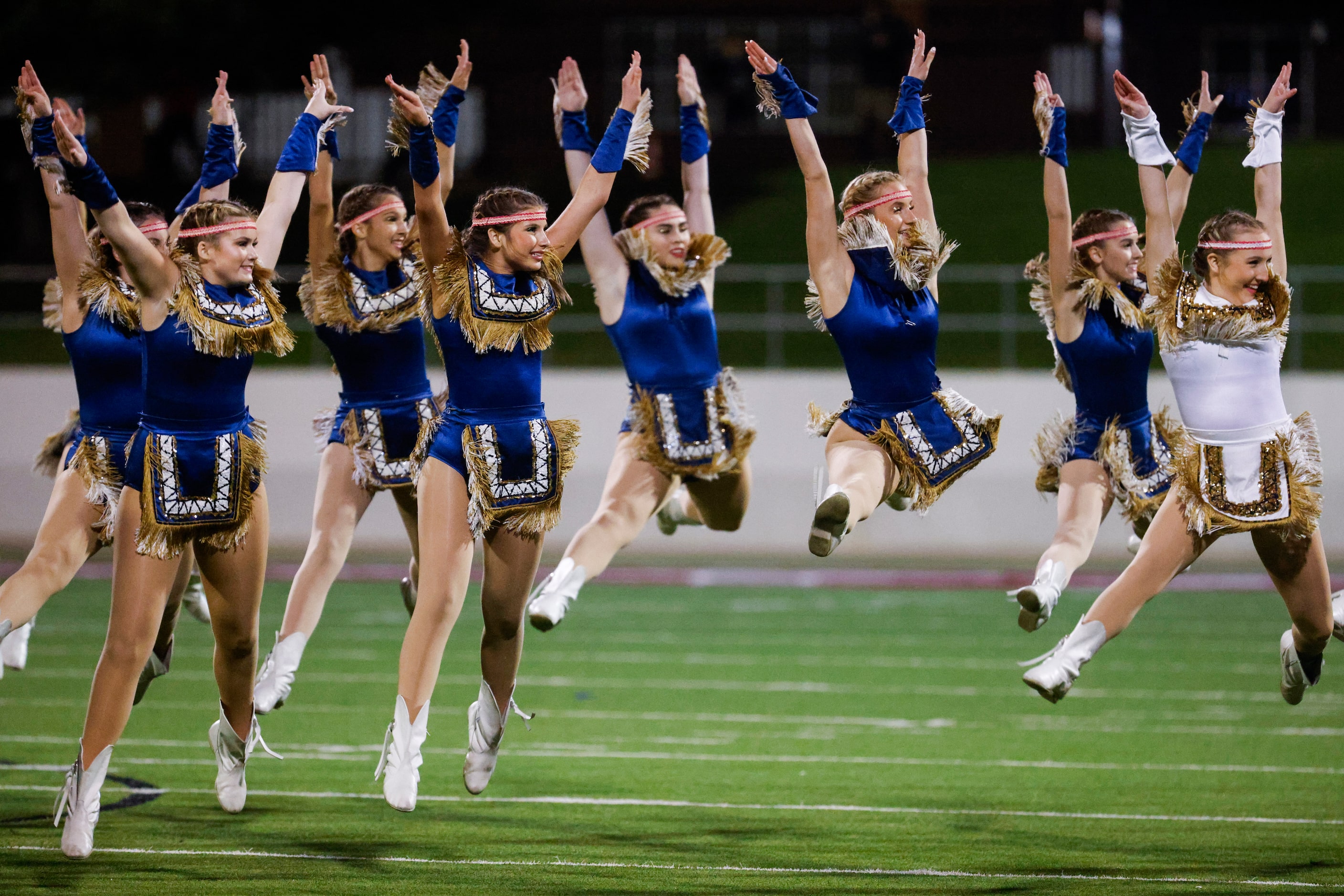 Keller High dance team performs during the half time of a football game against Byron Nelson...