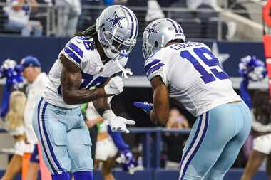 Dallas Cowboys' CeeDee Lamb (88) and Amari Cooper (19) celebrate a touchdown during the...