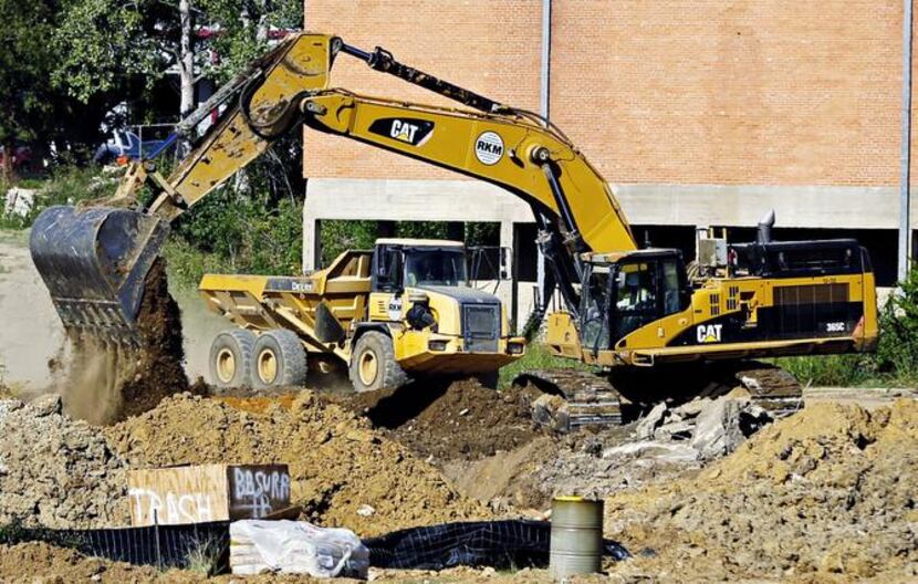 
Construction crews work on land near Dallas Love Field. With the Wright amendment’s...